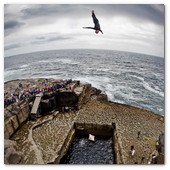:: Pulse para Ampliar :: Kent De Mond of the USA dives from the 28 metre platform during the second round of the fourth stop of the Red Bull Cliff Diving World Series, Inis Mor, Aran Islands, Ireland on August 3rd 2012.