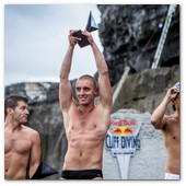 :: Pulse para Ampliar :: Event winner, Artem Silchenko (C) of Russia celebrates alongside second placed Orlando Duque (R) of Colombia and third placed Steven LoBue (L) of the USA during the fourth stop of the Red Bull Cliff Diving World Series, Inis Mor, Aran Islands, Ireland on August 4th 2012. 