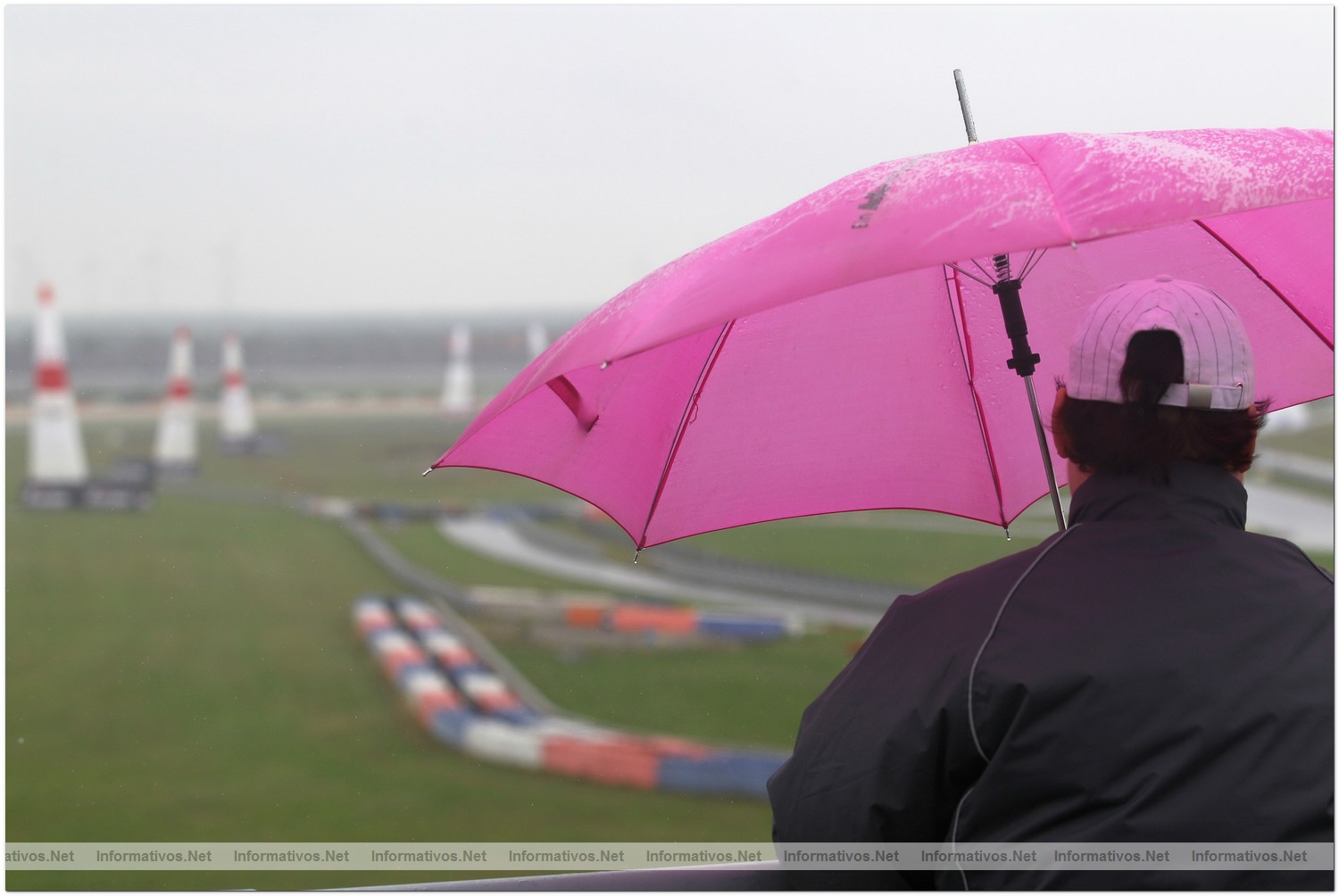 Fans wait in the rain for action during Qualifying  for Round 6 the Red Bull Air Race World Championship at the Eurospeedway, Lausitz on August 7, 2010 in Germany.