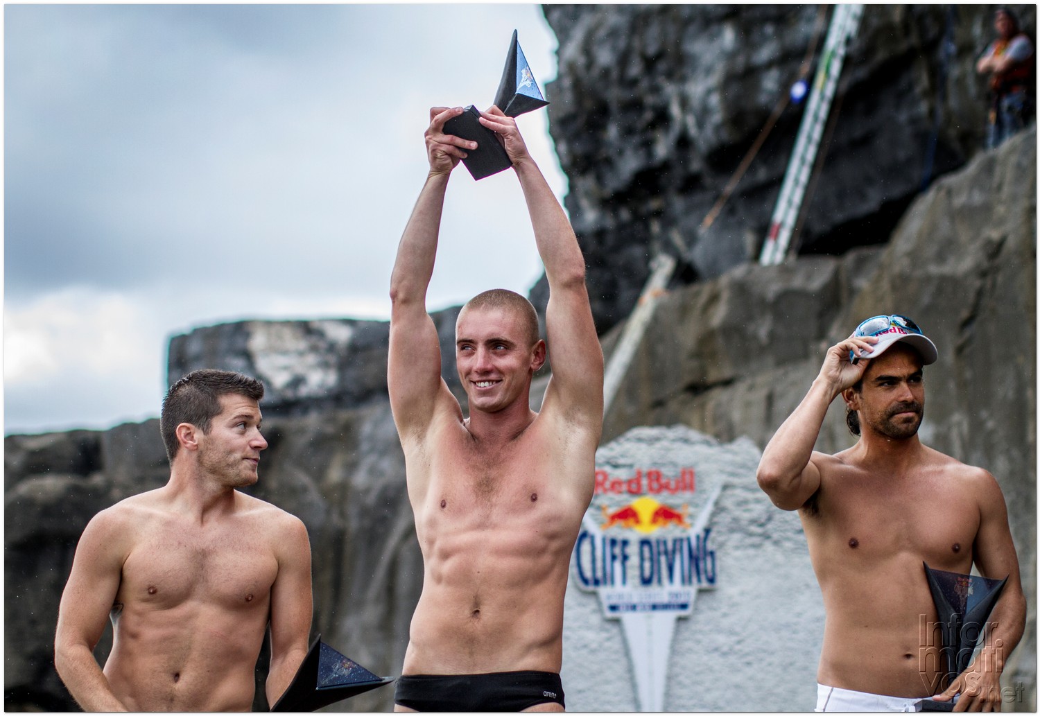 Event winner, Artem Silchenko (C) of Russia celebrates alongside second placed Orlando Duque (R) of Colombia and third placed Steven LoBue (L) of the USA during the fourth stop of the Red Bull Cliff Diving World Series, Inis Mor, Aran Islands, Ireland on August 4th 2012. 